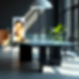 Modern office table with a sleek glass top reflecting natural light