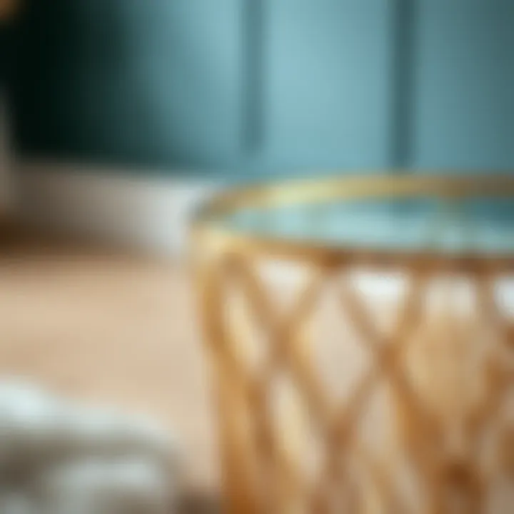 Close-up of the intricate design of a small gold glass side table