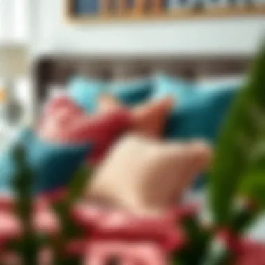 A stylish arrangement of coral and teal pillows on a bed