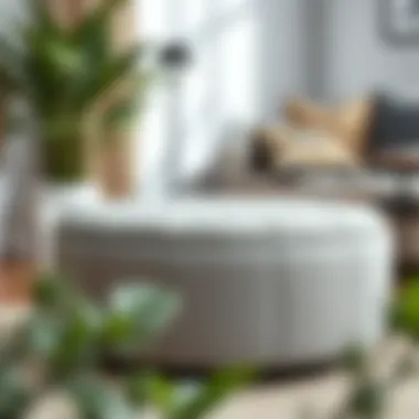 Elegant grey round storage ottoman placed in a minimalist décor