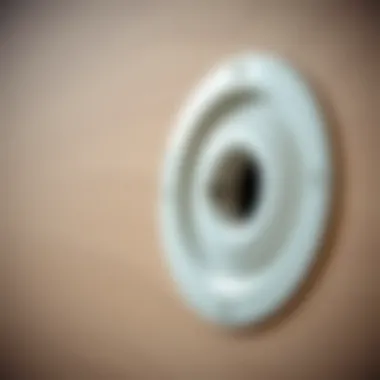 Close-up of a plastic hole cover installed on a wall
