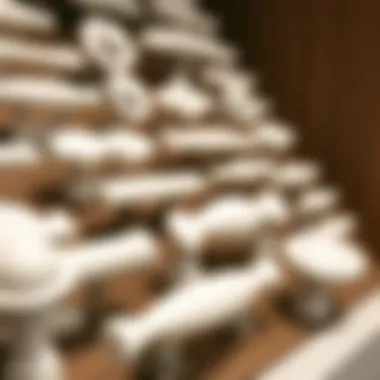 Close-up of various styles of white drawer pulls displayed