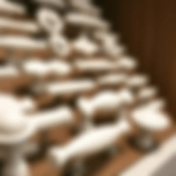 Close-up of various styles of white drawer pulls displayed